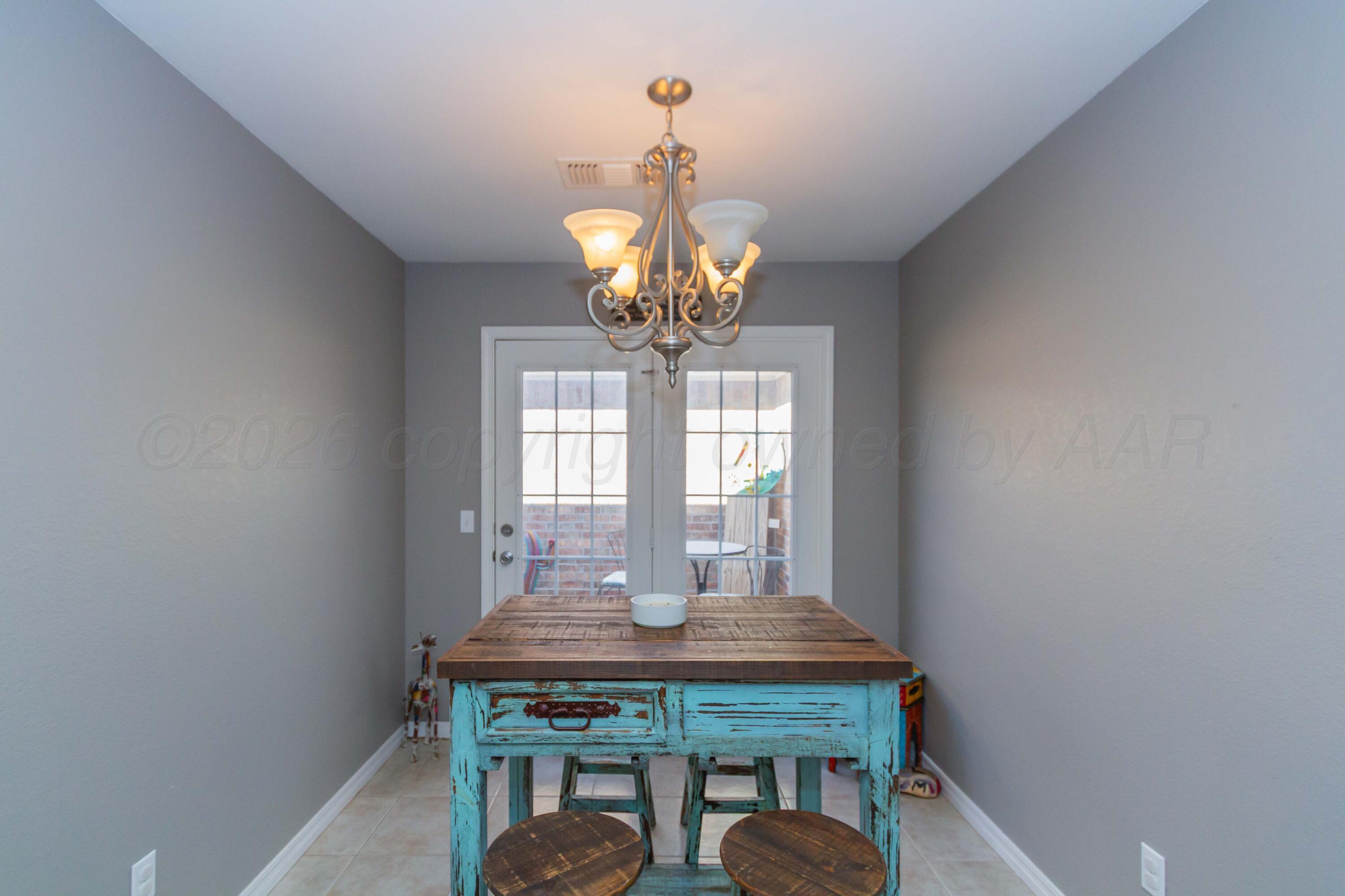 2802 Steve's Way Amarillo, TX 79118 - Photo 14 of 30 a view of a dining room with a table and chairs