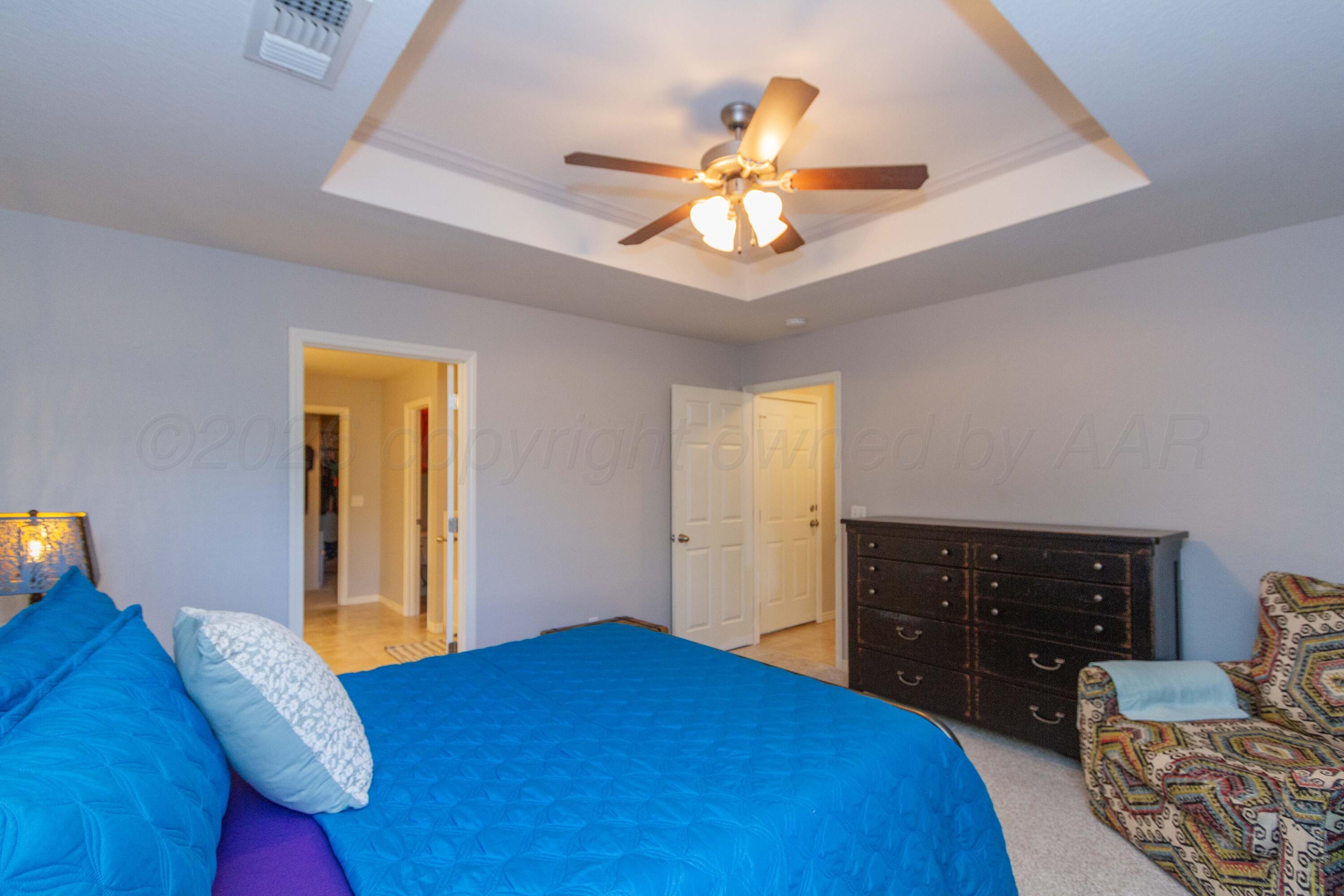 2802 Steve's Way Amarillo, TX 79118 - Photo 16 of 30 a bedroom with a bed and a dresser