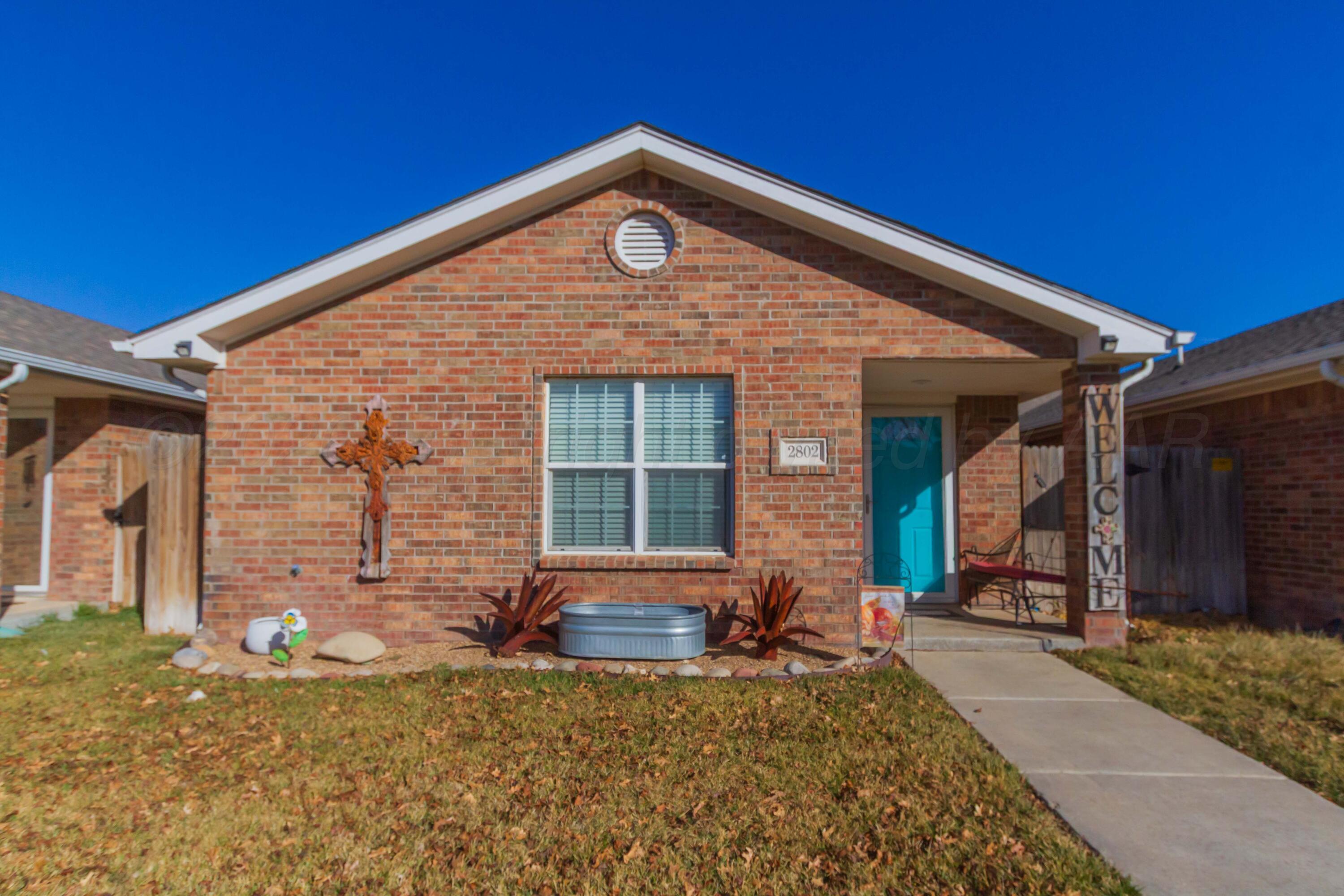 2802 Steve's Way Amarillo, TX 79118 - Photo 2 of 30 a front view of a house with garden