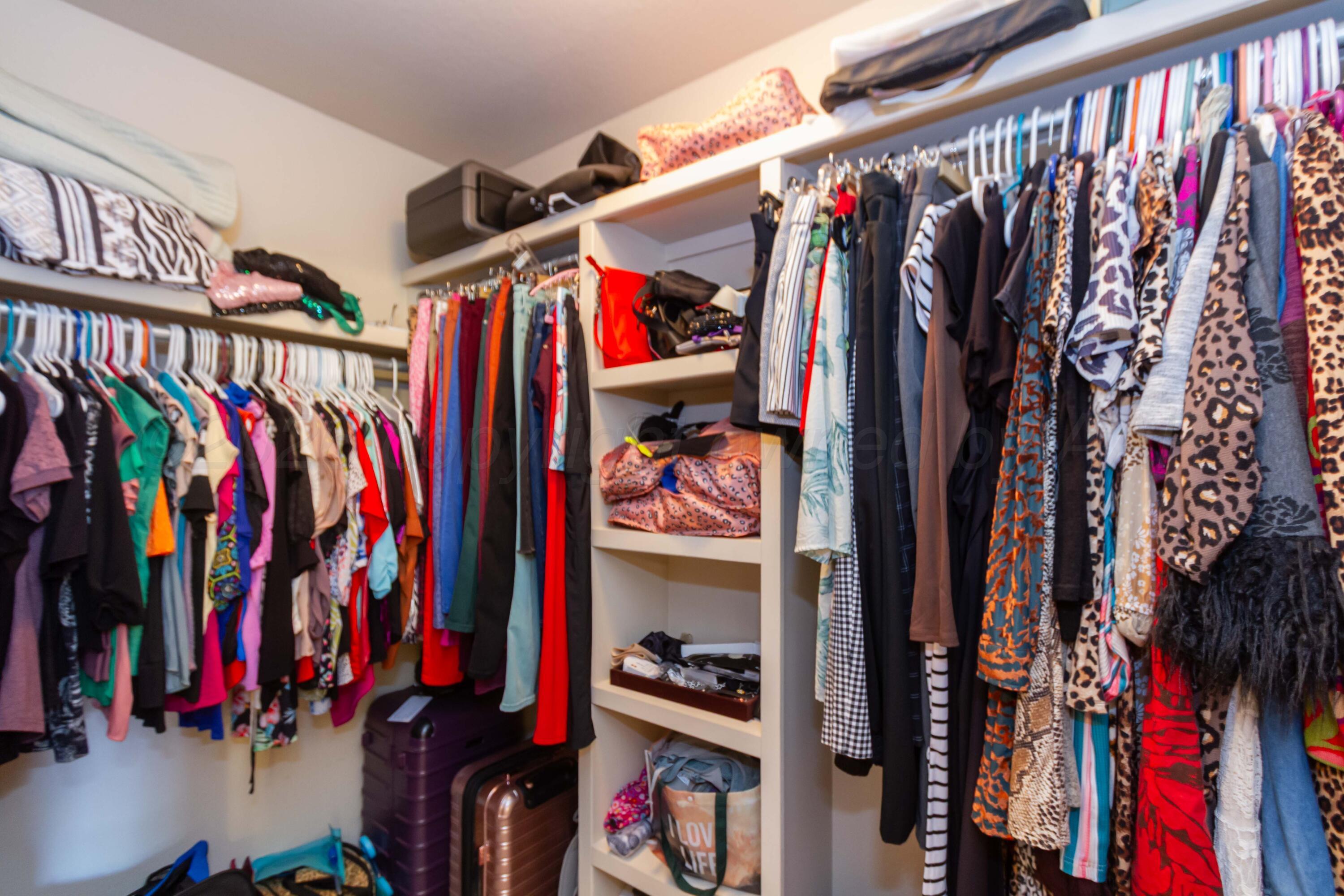 2802 Steve's Way Amarillo, TX 79118 - Photo 21 of 30 a view of walk in closet with clothes