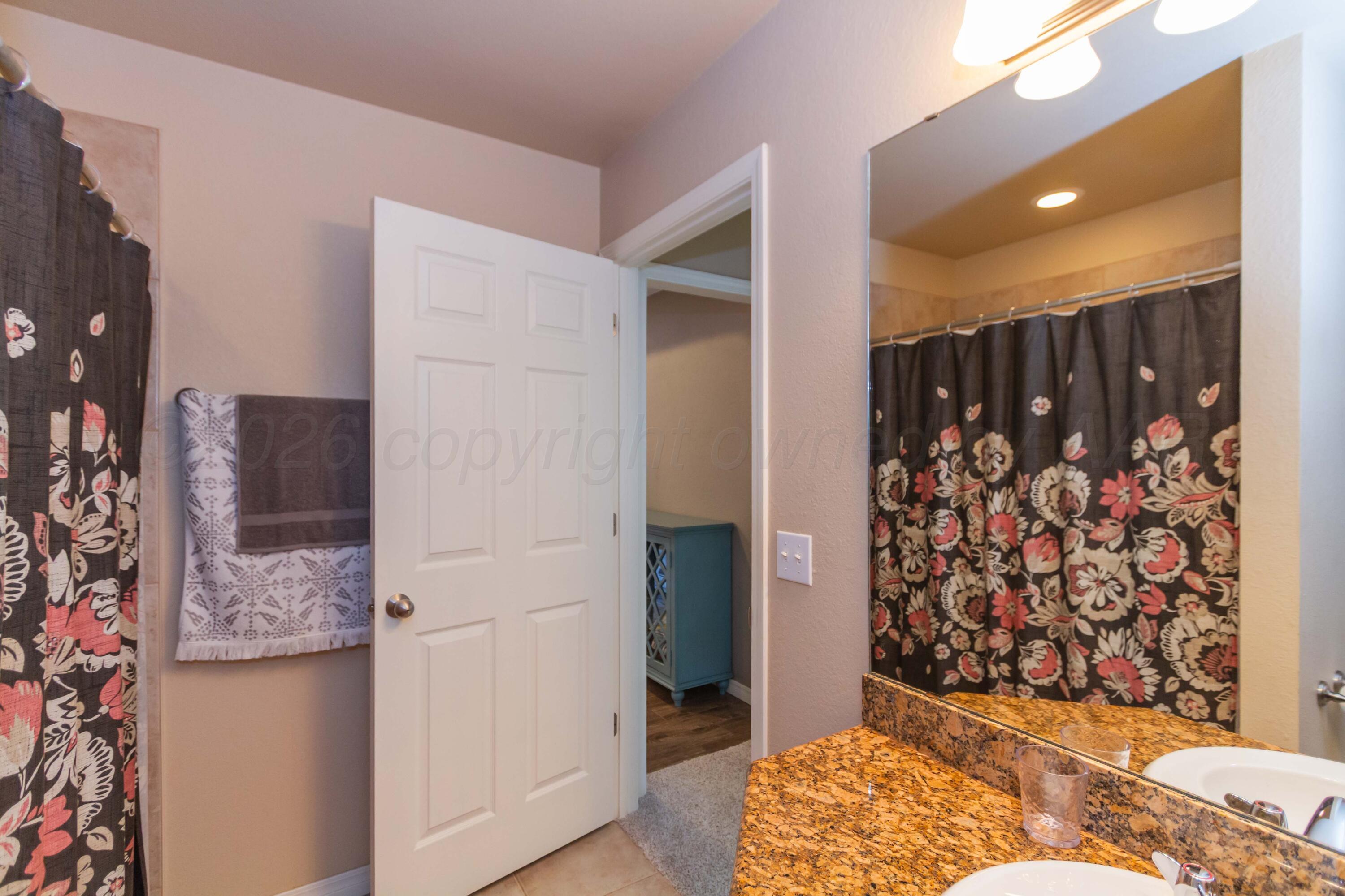2802 Steve's Way Amarillo, TX 79118 - Photo 25 of 30 a view of wooden floor and closet in a bathroom
