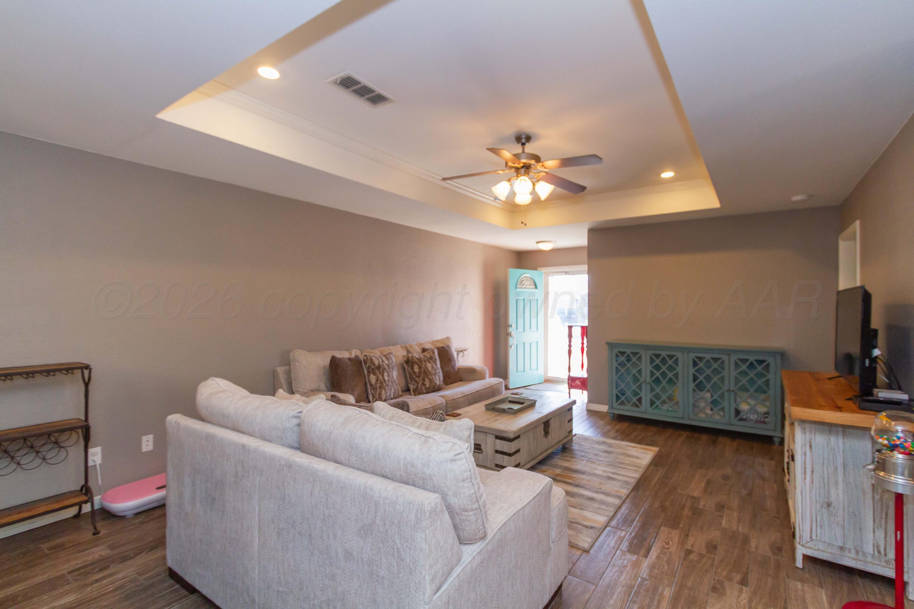 2802 Steve's Way Amarillo, TX 79118 - Photo 5 of 30 a living room with furniture and a wooden floor