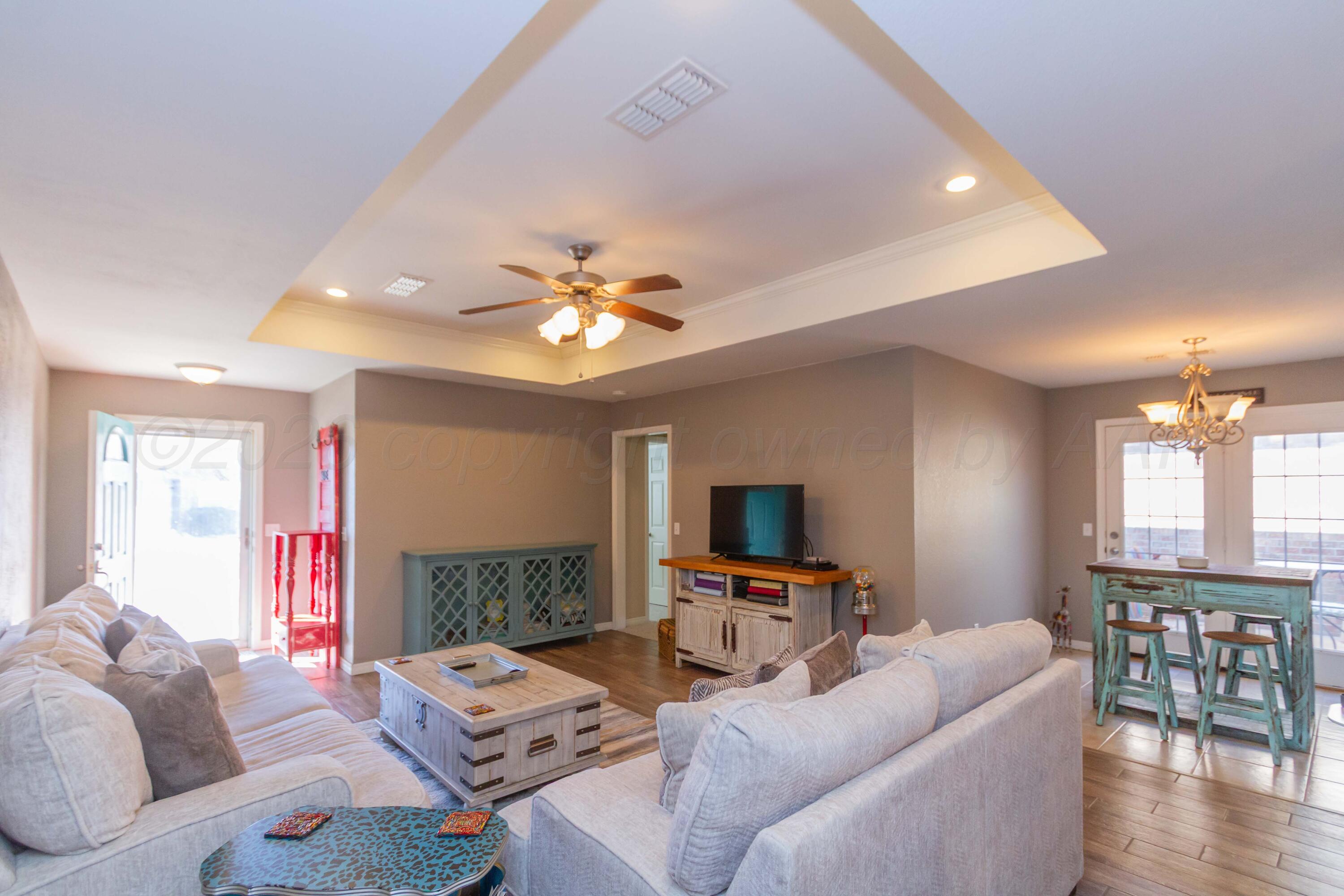 2802 Steve's Way Amarillo, TX 79118 - Photo 6 of 30 a living room with furniture and a flat screen tv