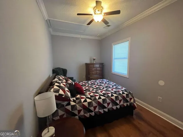 a bedroom with a bed and window