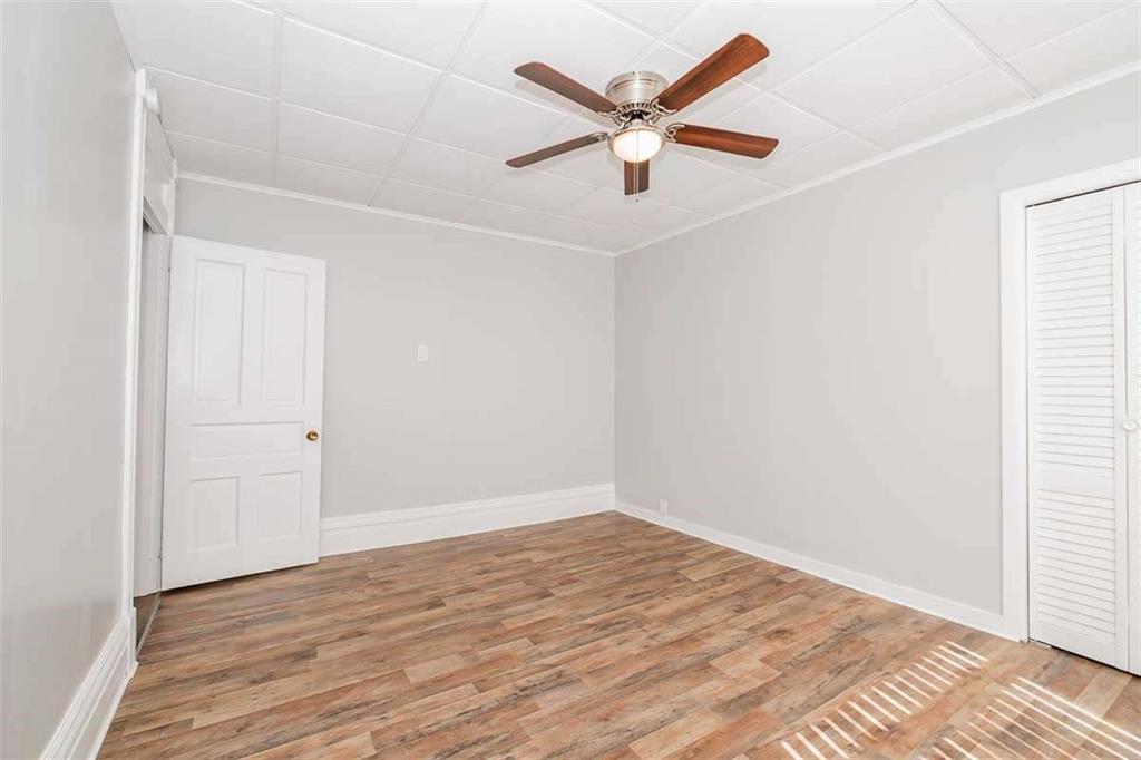 97 Royal Street Pittsburgh, PA 15212 - Photo 16 of 24 an empty room with wooden floor and windows