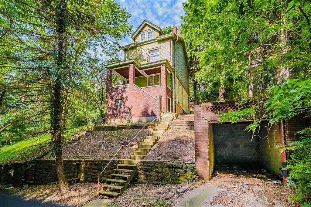 97 Royal Street Pittsburgh, PA 15212 - Photo 2 of 24 a front view of a house with trees