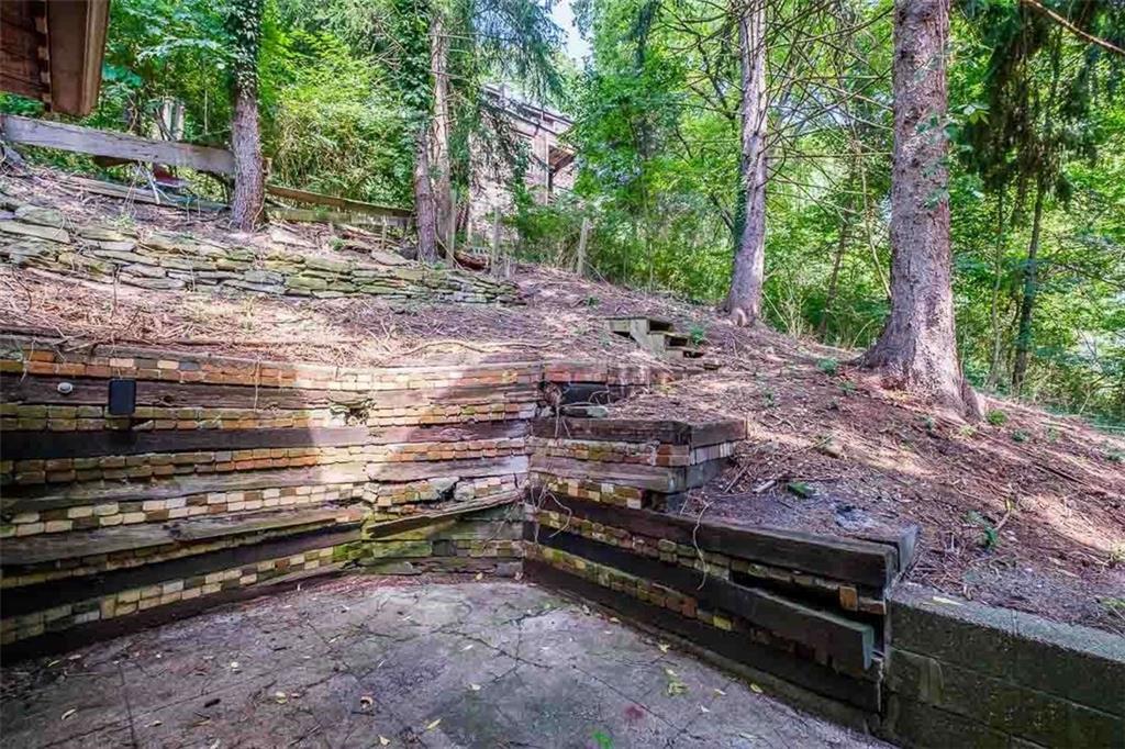 97 Royal Street Pittsburgh, PA 15212 - Photo 24 of 24 a backyard of a house with lots of green space and chair