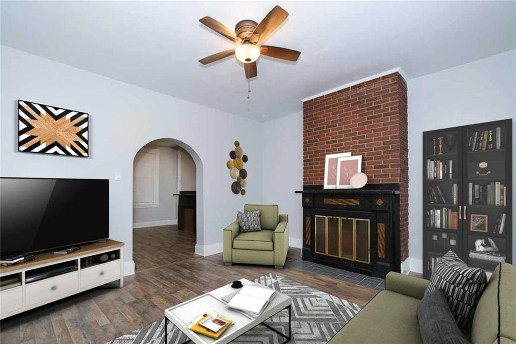 97 Royal Street Pittsburgh, PA 15212 - Photo 6 of 24 a living room with furniture and a flat screen tv