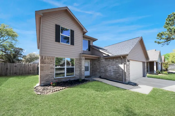 front view of a house with a yard
