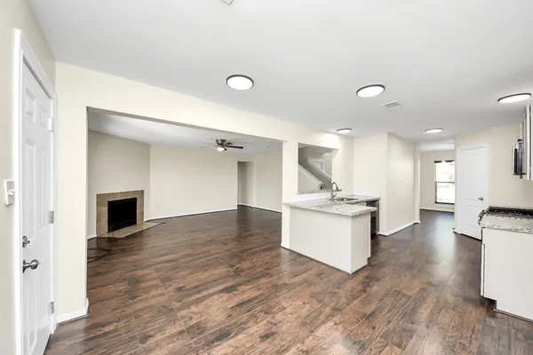a large kitchen with a stove and a sink