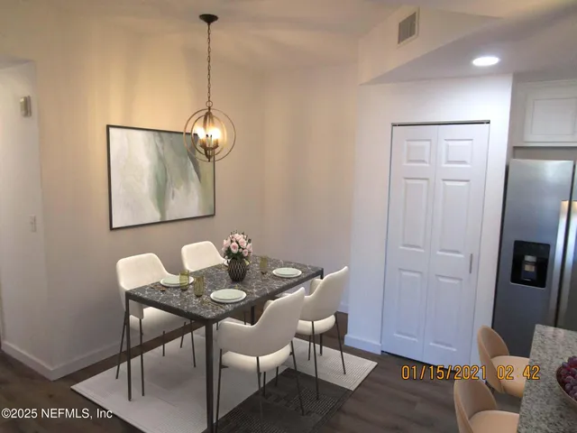 a dining room with furniture and window