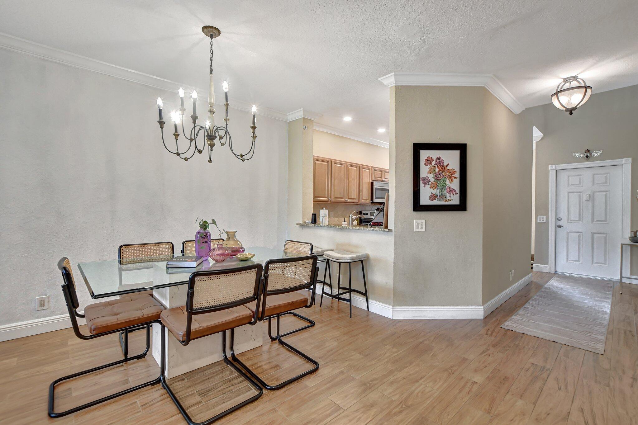 6682 Via Regina Boca Raton, FL 33433 - Photo 24 of 46 a view of a dining room with furniture