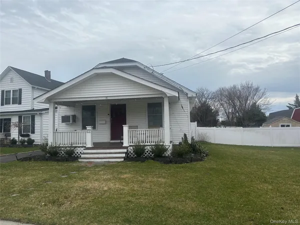 a kitchen with a refrigerator and a stove top oven