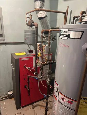a utility room with dryer washer and empty racks