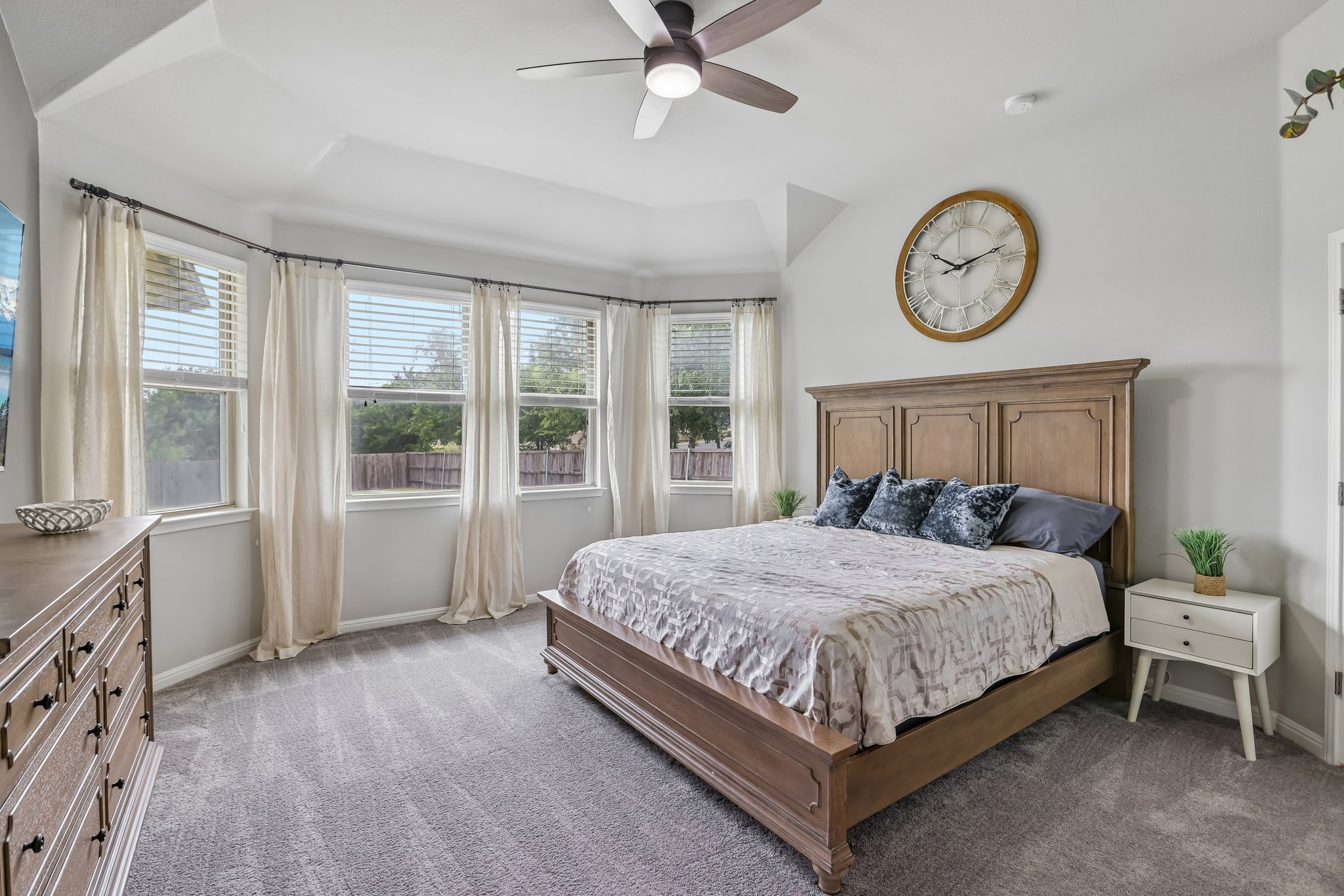 6801 Banff Cove Austin, TX 78754 - Photo 16 of 37 Primary bedroom features bay windows, and recently replaced carpeted flooring