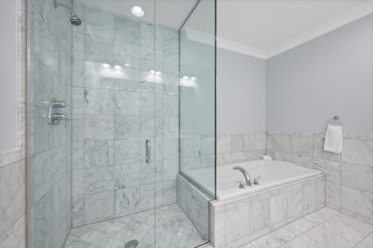 55 East Erie Street, Unit 1903 Chicago, IL 60611 - Photo 23 of 39 a bathroom with a bathtub and shower