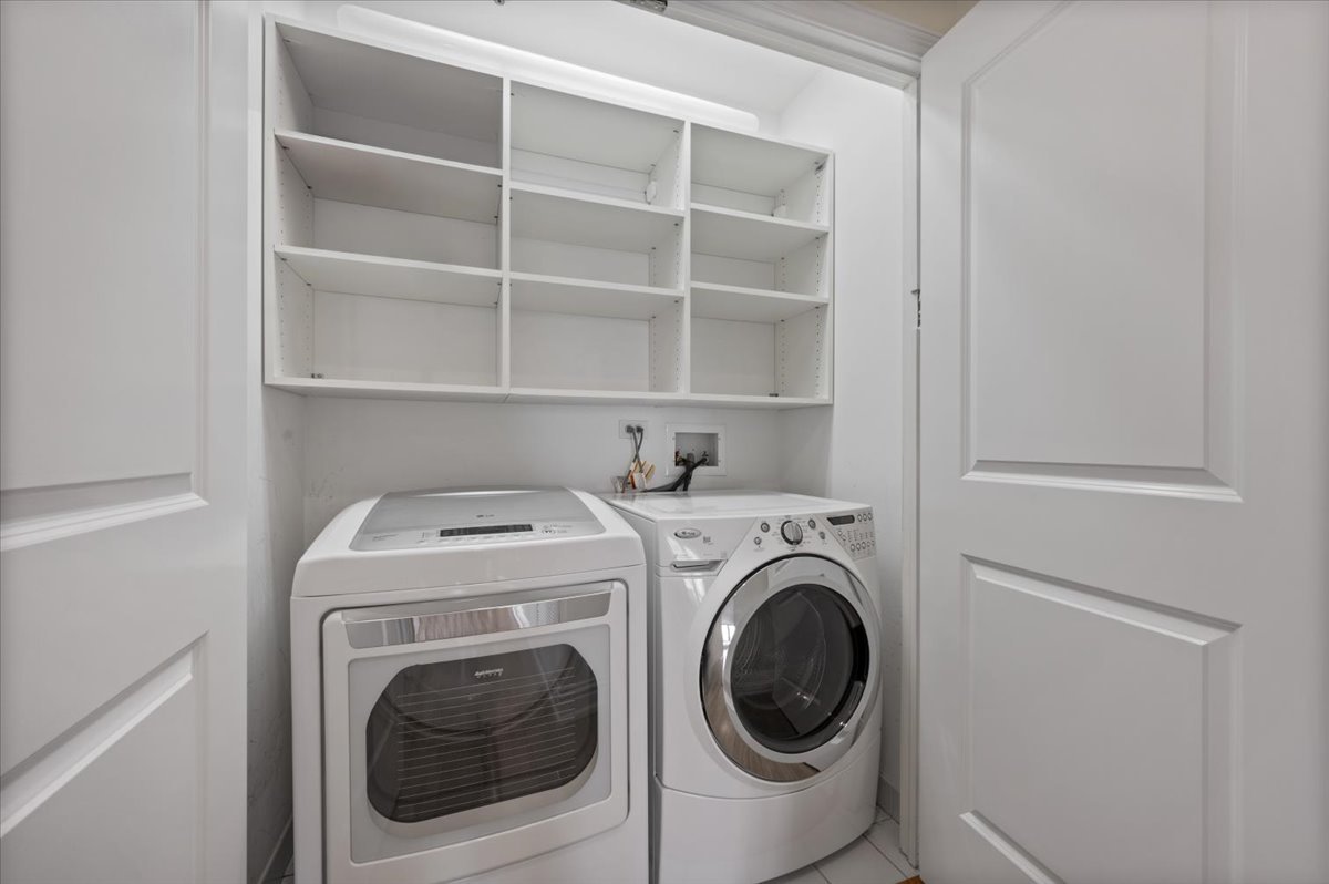 55 East Erie Street, Unit 1903 Chicago, IL 60611 - Photo 31 of 39 a utility room with dryer and washer
