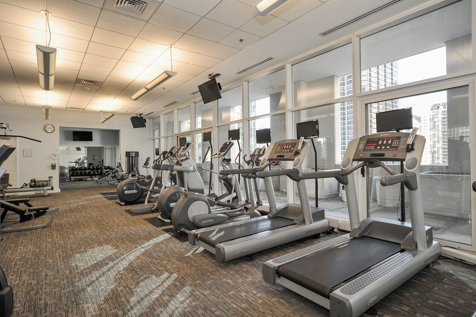 55 East Erie Street, Unit 1903 Chicago, IL 60611 - Photo 38 of 39 a view of a room with gym equipment