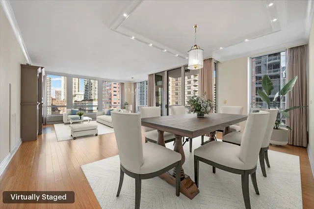 a view of a dining room with furniture window and wooden floor
