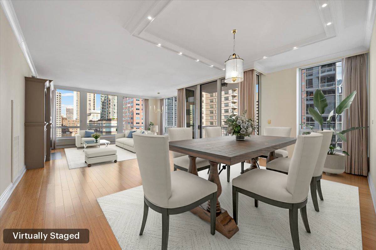 55 East Erie Street, Unit 1903 Chicago, IL 60611 - Photo 4 of 39 a view of a dining room with furniture window and wooden floor