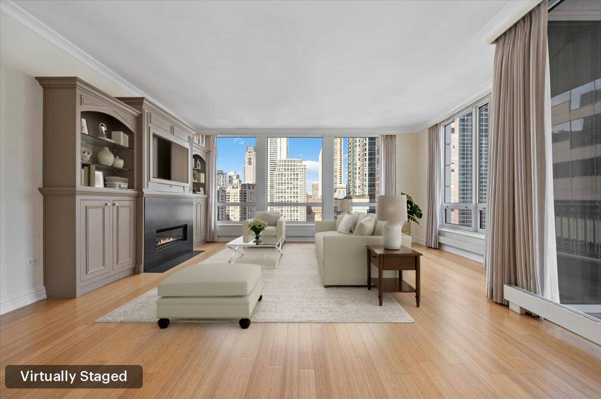 55 East Erie Street, Unit 1903 Chicago, IL 60611 - Photo 6 of 39 a living room with furniture and a fireplace
