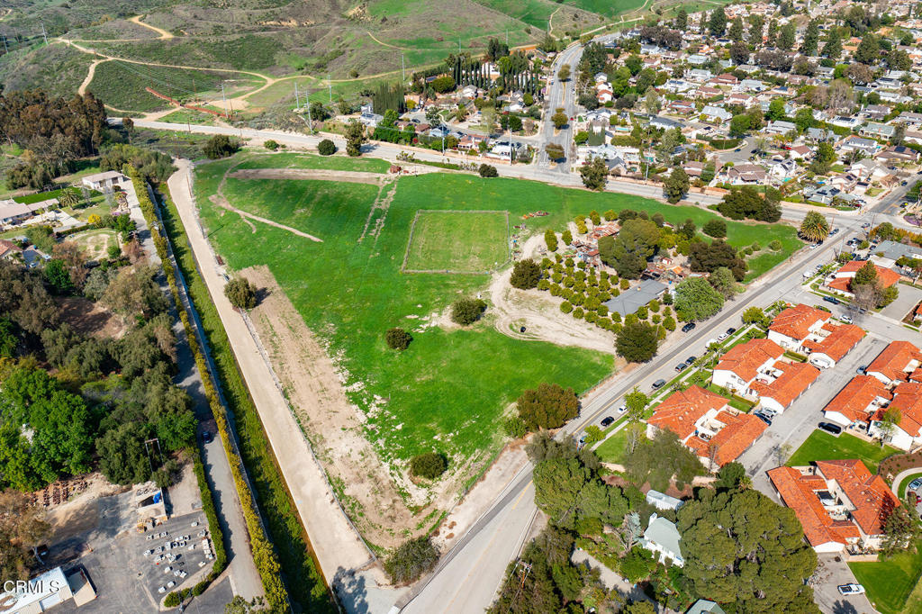 3941 Walnut Avenue Simi Valley, CA 93063 - Photo 3 of 26 view of a lake with a building in the background