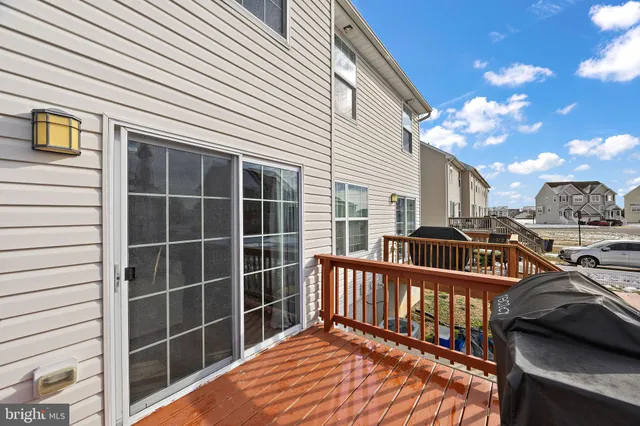 a view of a building with cars parked