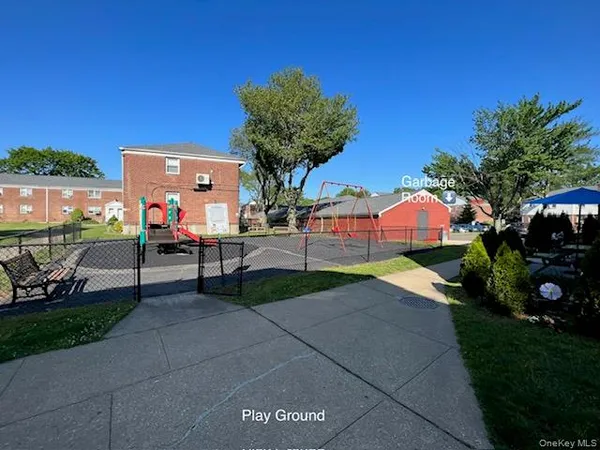 a view of a backyard with sitting area