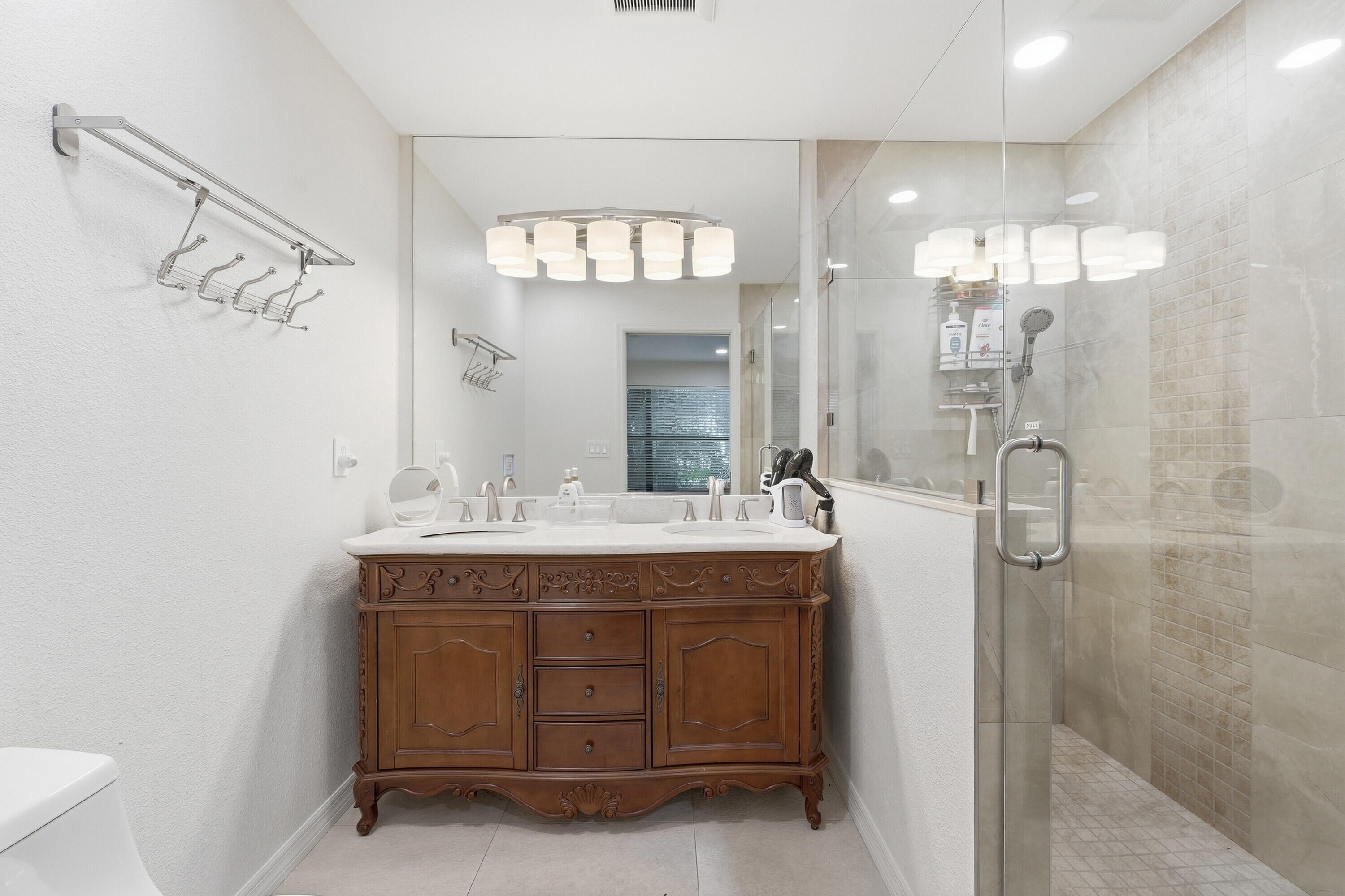 200 Windy Point Road Lake Placid, FL 33852 - Photo 31 of 74 a bathroom with a double vanity sink and a mirror