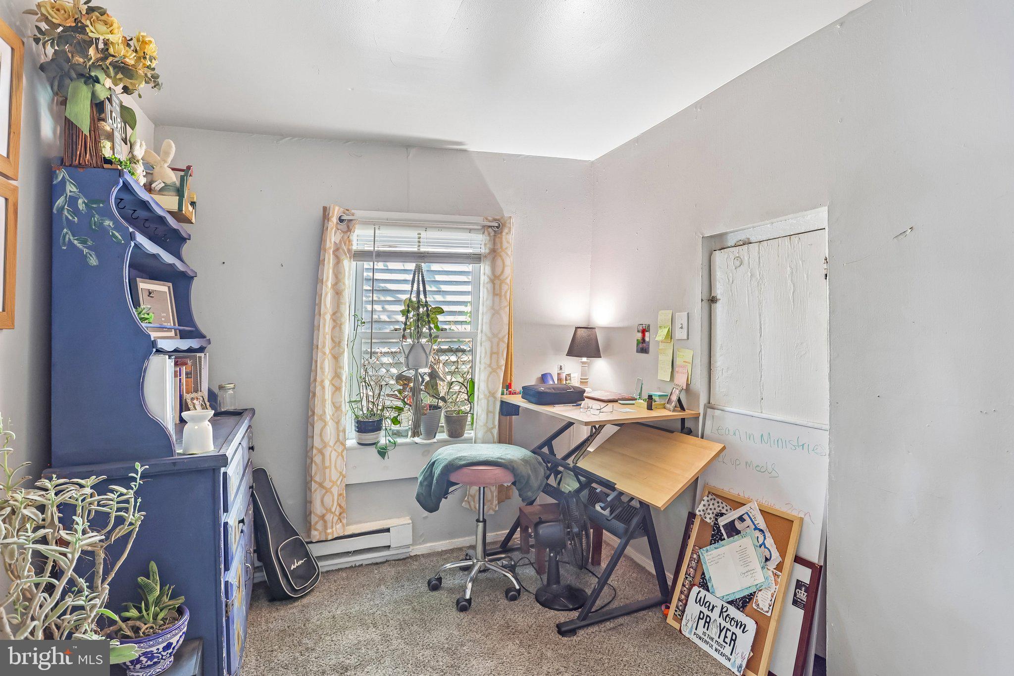64 Union Street Salem, NJ 08079 - Photo 14 of 32 a view of a workspace with furniture and a window