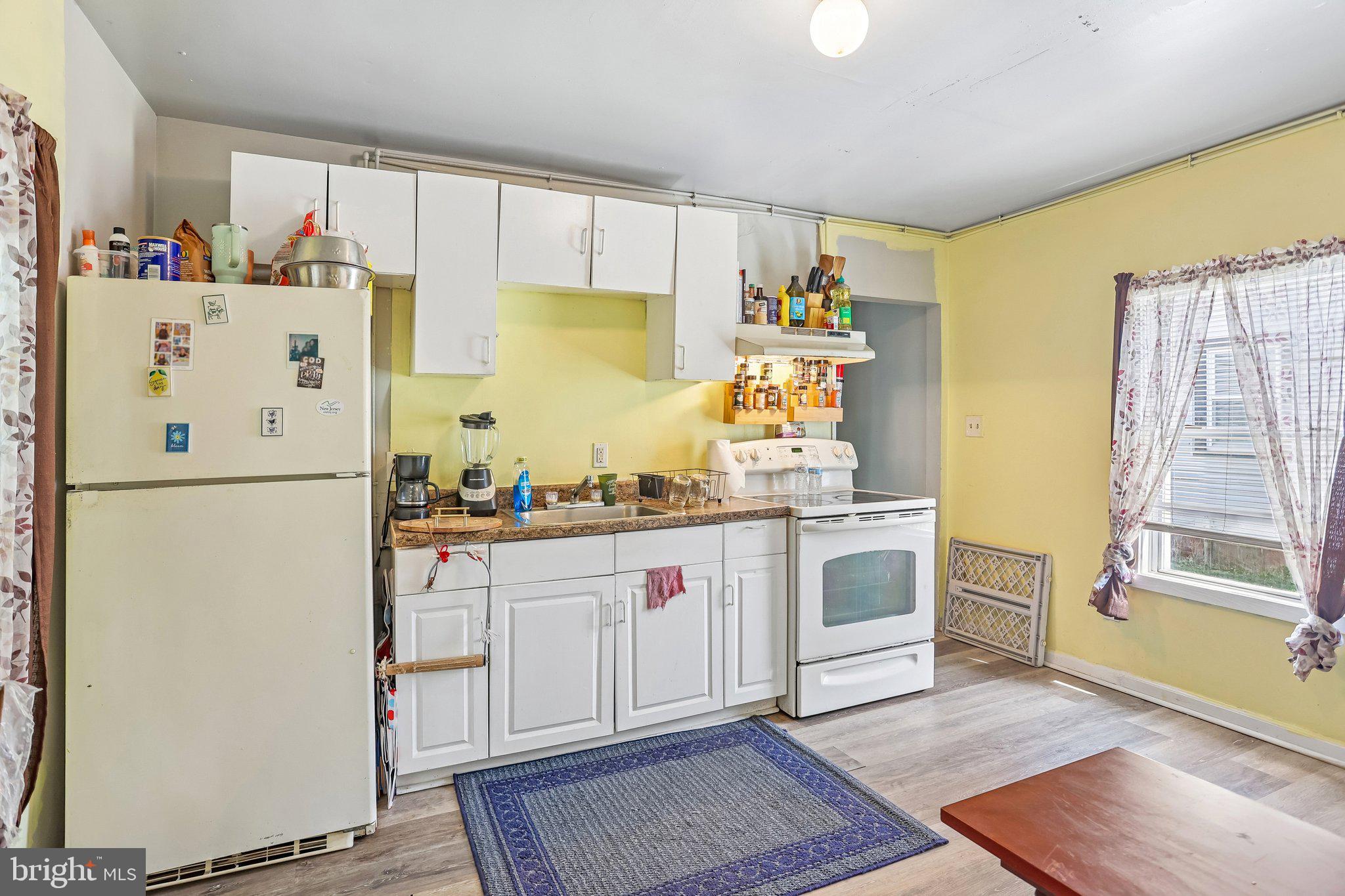 64 Union Street Salem, NJ 08079 - Photo 10 of 32 a kitchen with a refrigerator and a sink