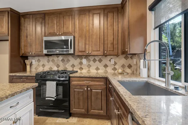 a view of room with wooden floor