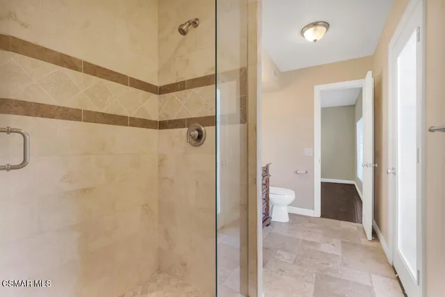 a large bathroom with a tub and a sink