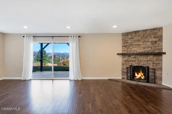 a large bathroom with a tub and a sink