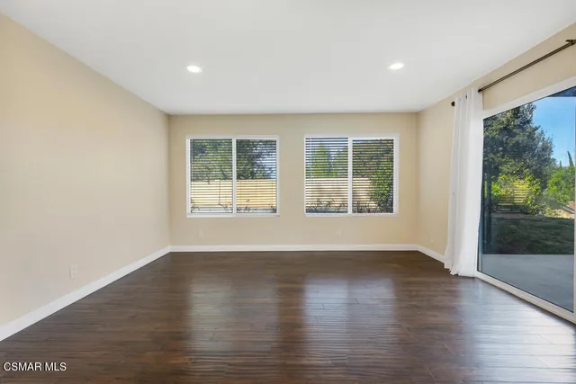 a view of empty room with a fireplace
