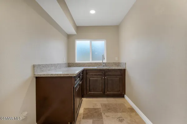 a white bath tub sitting in a bathroom next to a window
