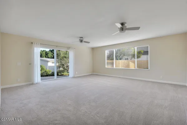 a bathroom with a shower sink and mirror
