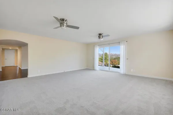 a bathroom with a large tub a sink a window and a shower