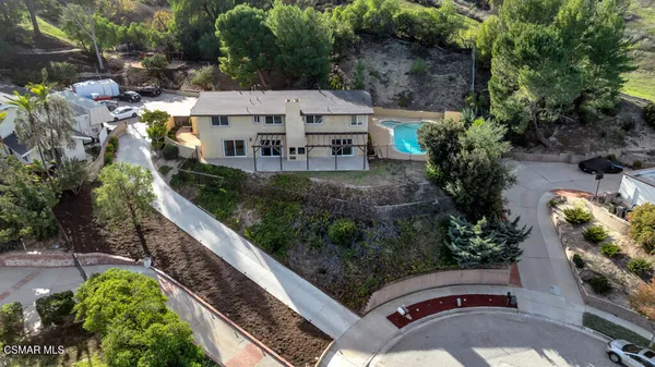a kitchen with kitchen island granite countertop a sink counter top space appliances and cabinets