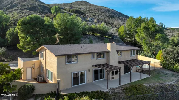 a kitchen with granite countertop a sink stainless steel appliances and cabinets