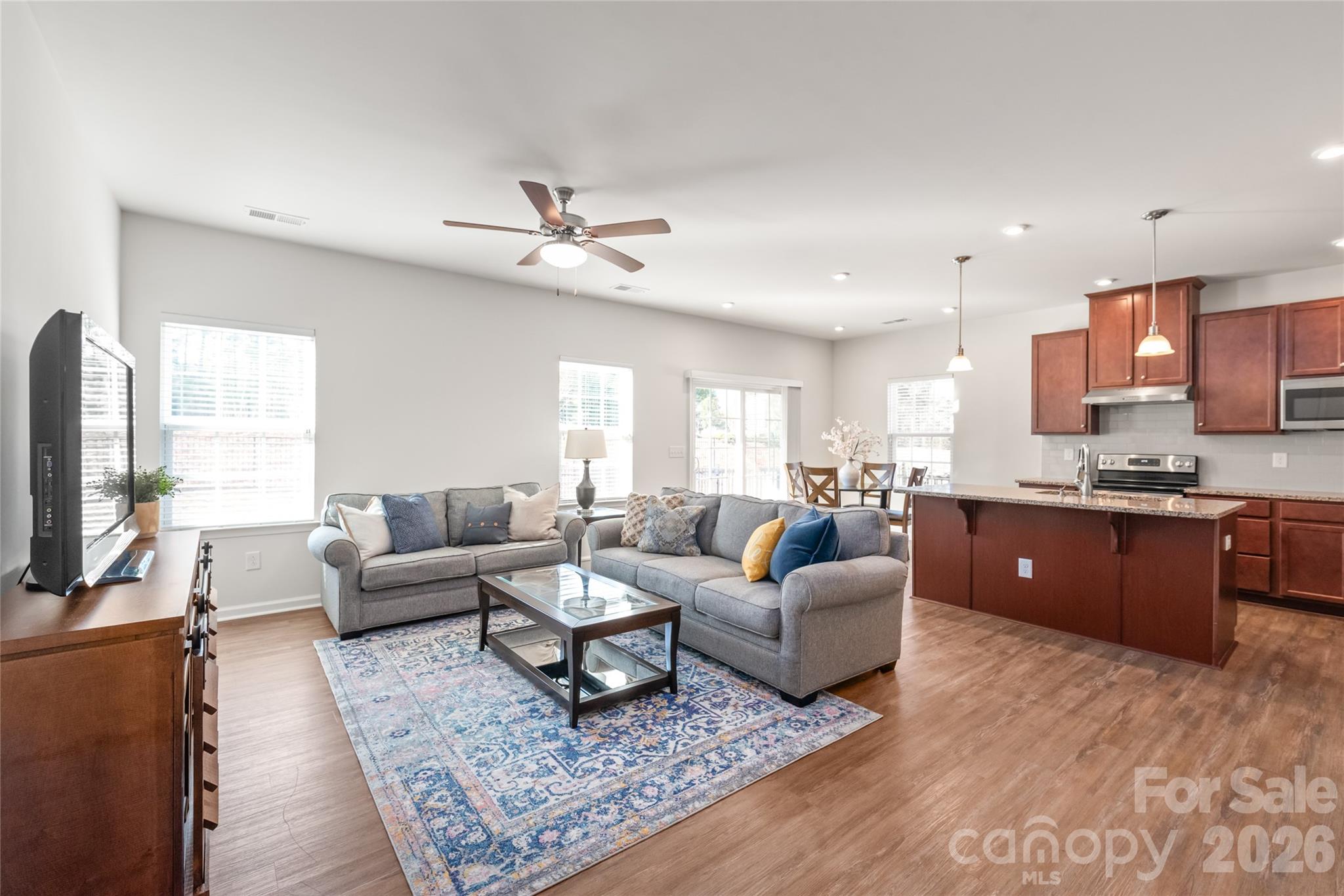 1960 Slippery Rock Lane Monroe, NC 28112 - Photo 12 of 32 a living room with furniture flat screen tv and window