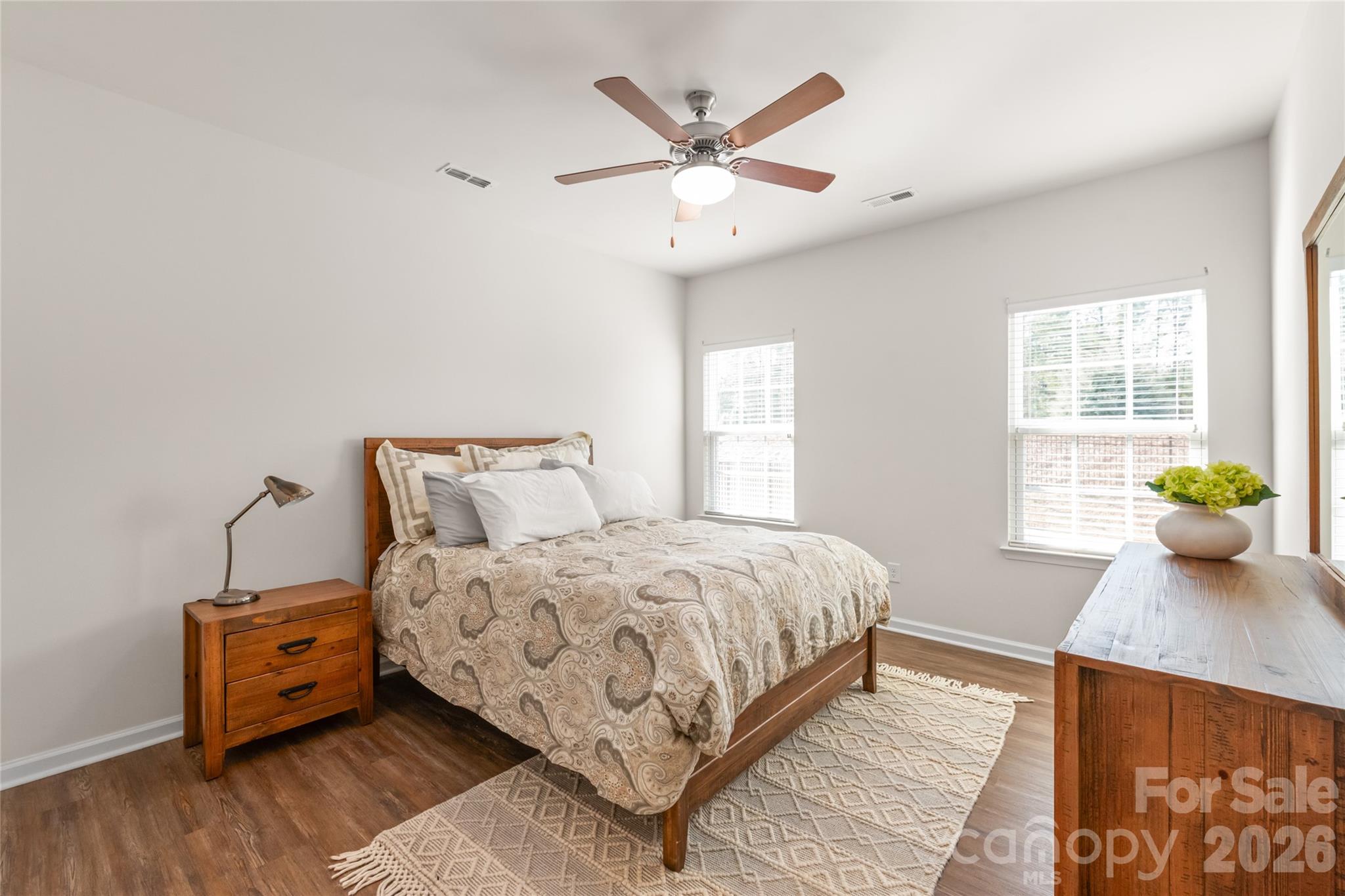 1960 Slippery Rock Lane Monroe, NC 28112 - Photo 14 of 32 a bedroom with a bed and a potted plant
