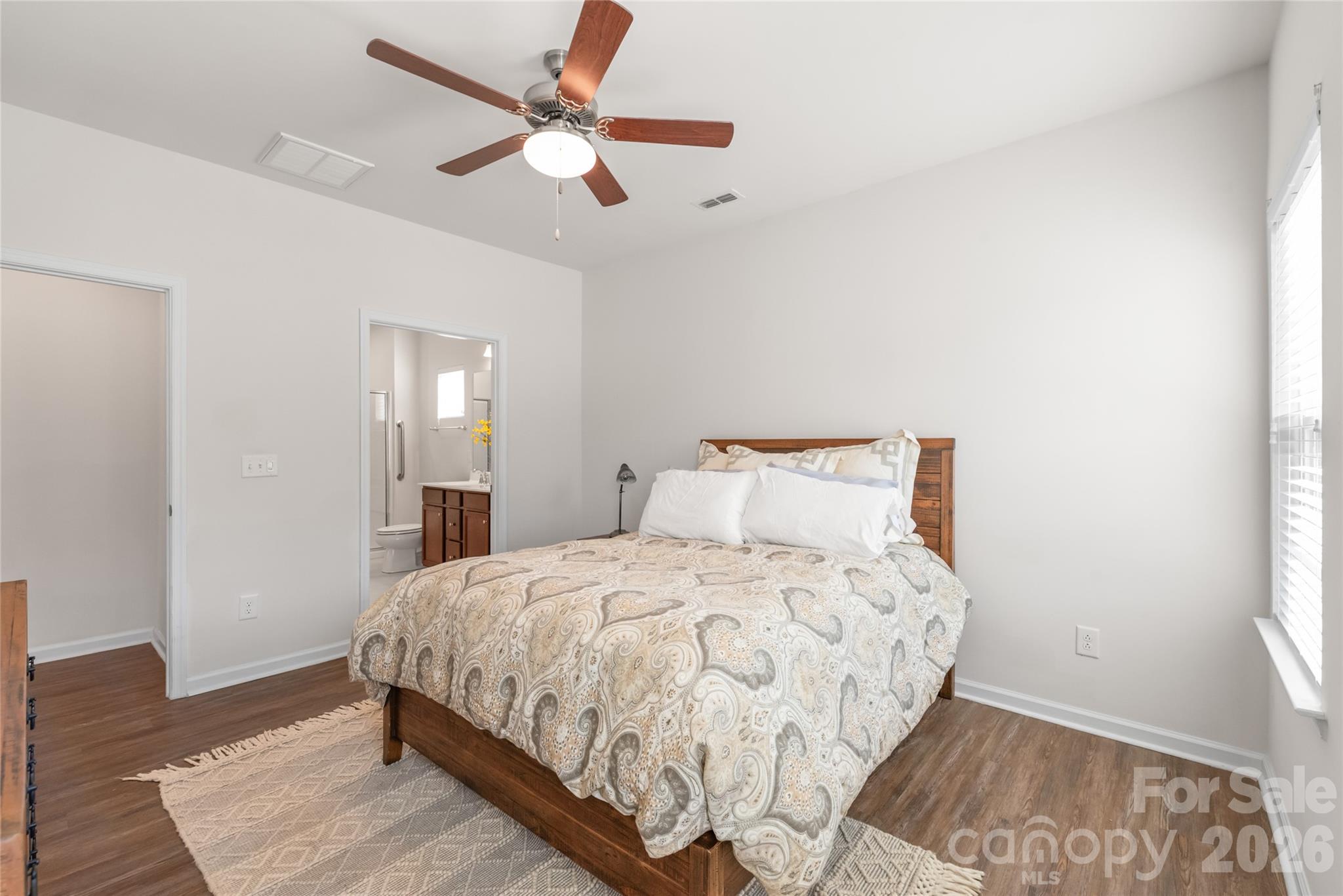 1960 Slippery Rock Lane Monroe, NC 28112 - Photo 15 of 32 a bedroom with a bed and a window