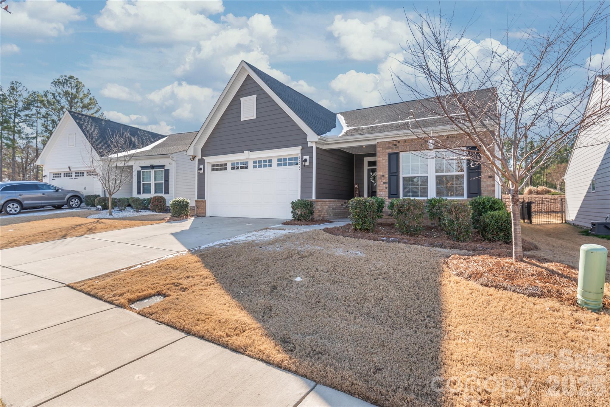 1960 Slippery Rock Lane Monroe, NC 28112 - Photo 2 of 32 a view of a brick house with a yard