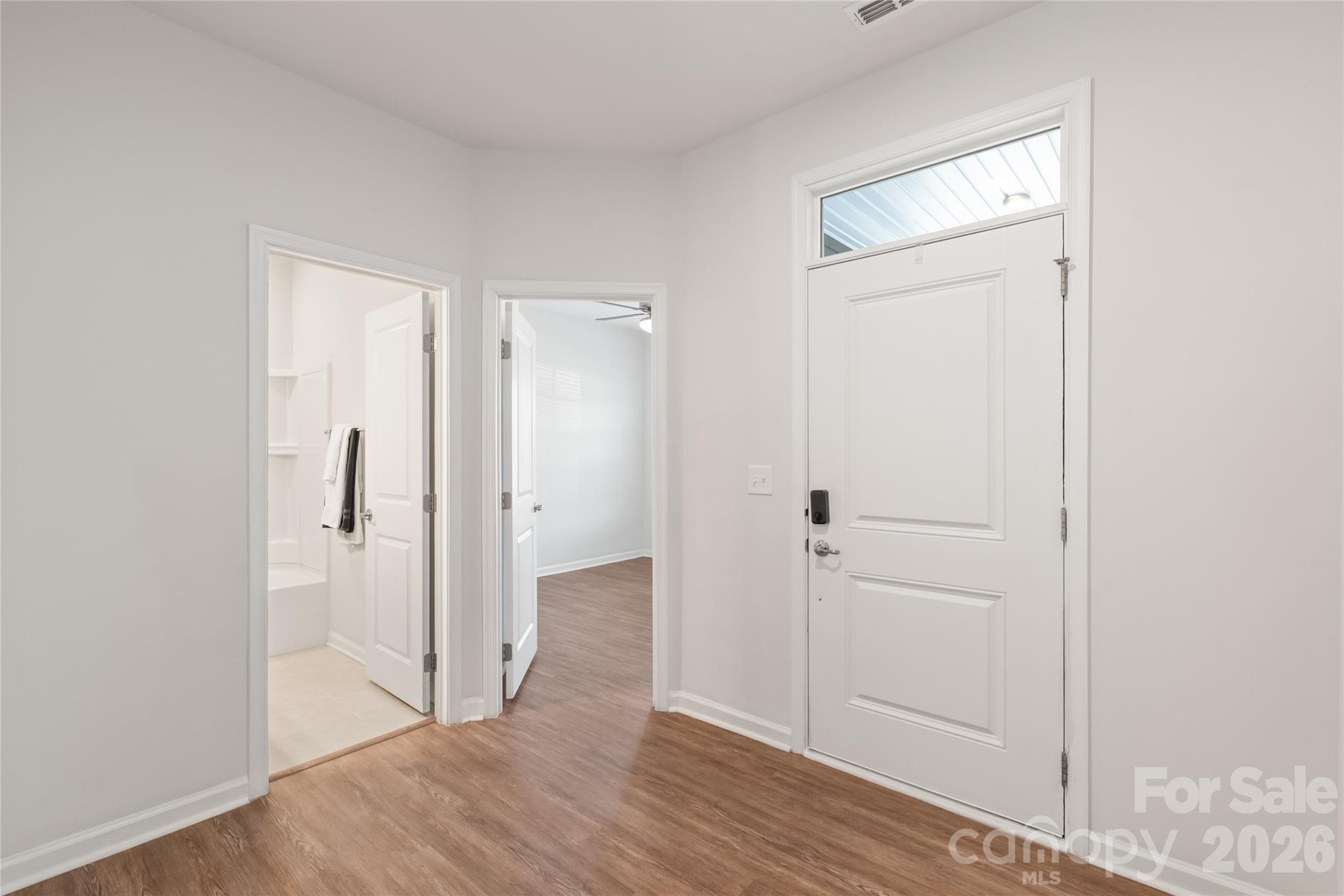 1960 Slippery Rock Lane Monroe, NC 28112 - Photo 21 of 32 a view of a hallway with wooden floor