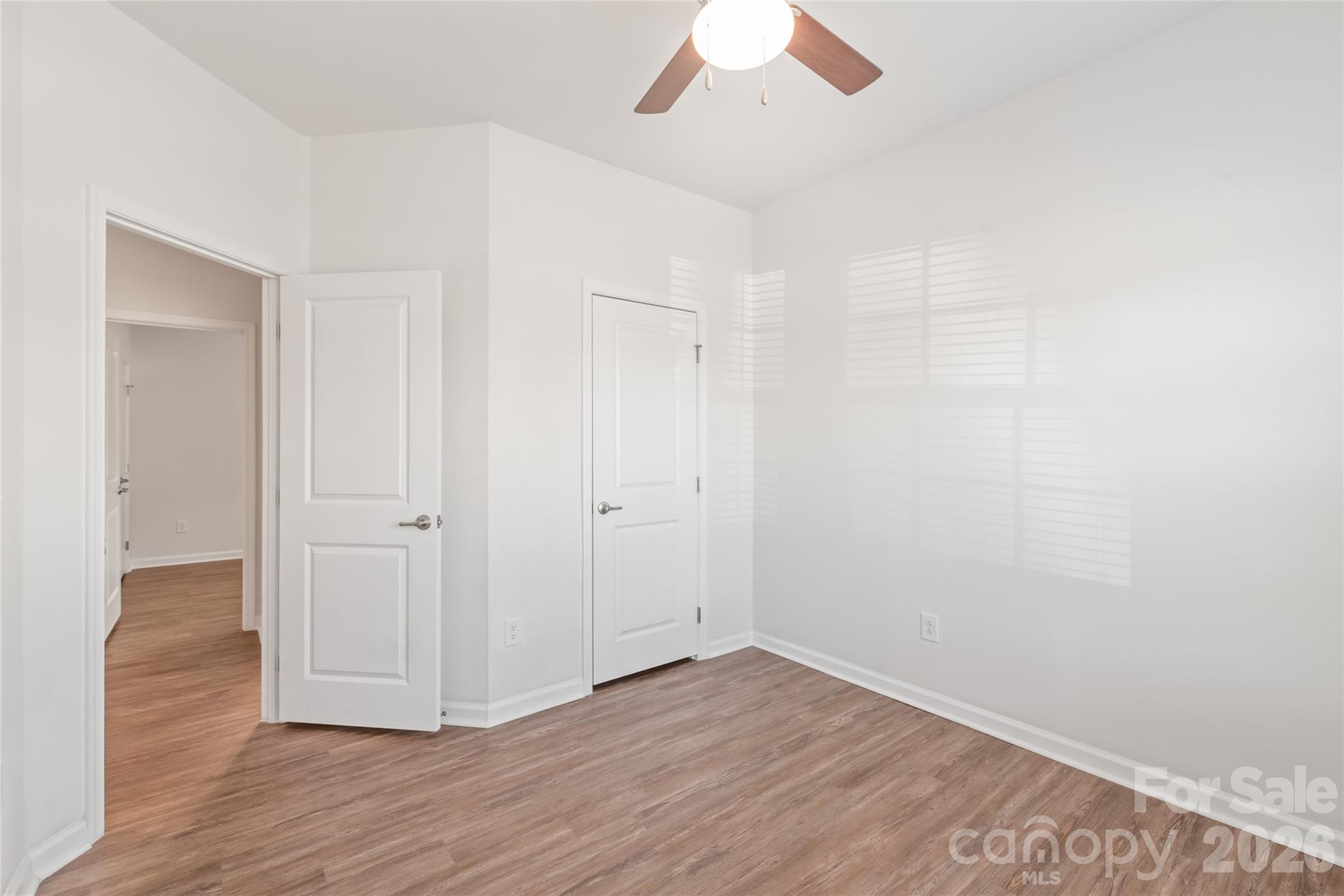 1960 Slippery Rock Lane Monroe, NC 28112 - Photo 23 of 32 a view of an empty room with wooden floor