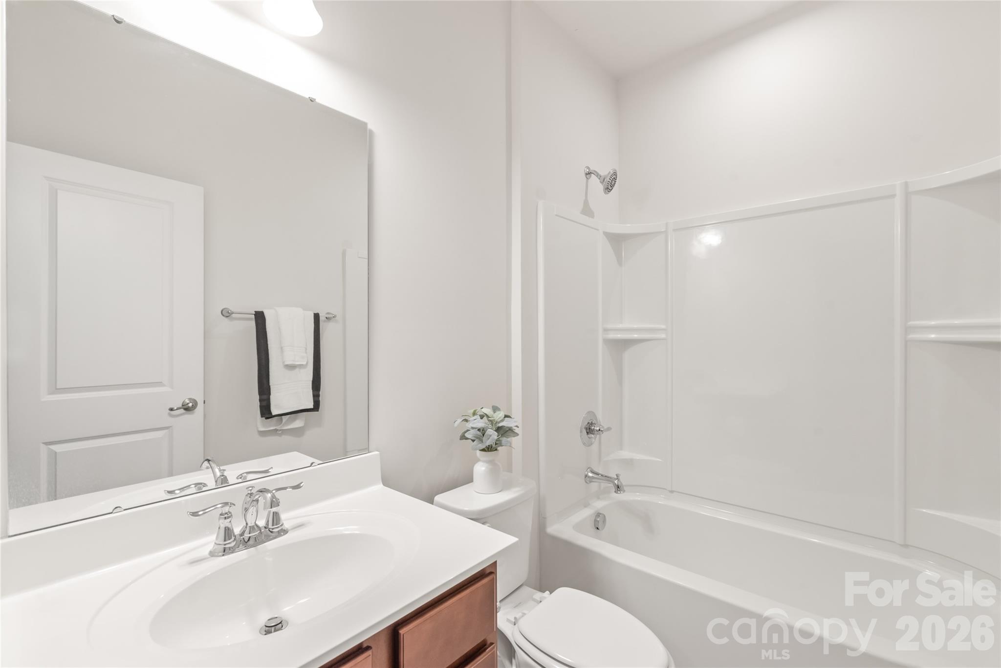 1960 Slippery Rock Lane Monroe, NC 28112 - Photo 24 of 32 a bathroom with a bathtub shower sink and toilet