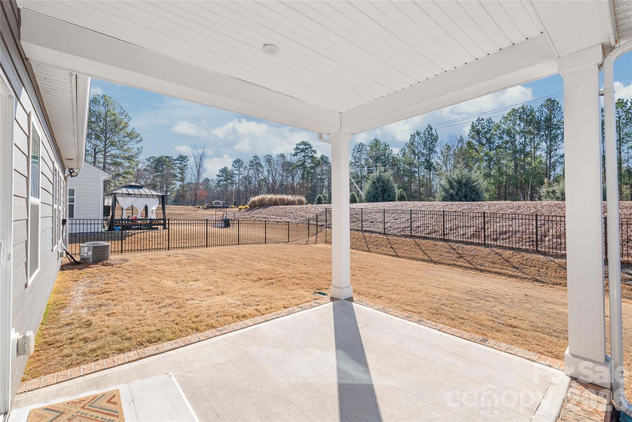 1960 Slippery Rock Lane Monroe, NC 28112 - Photo 26 of 32 a view of a living room and floor to ceiling window