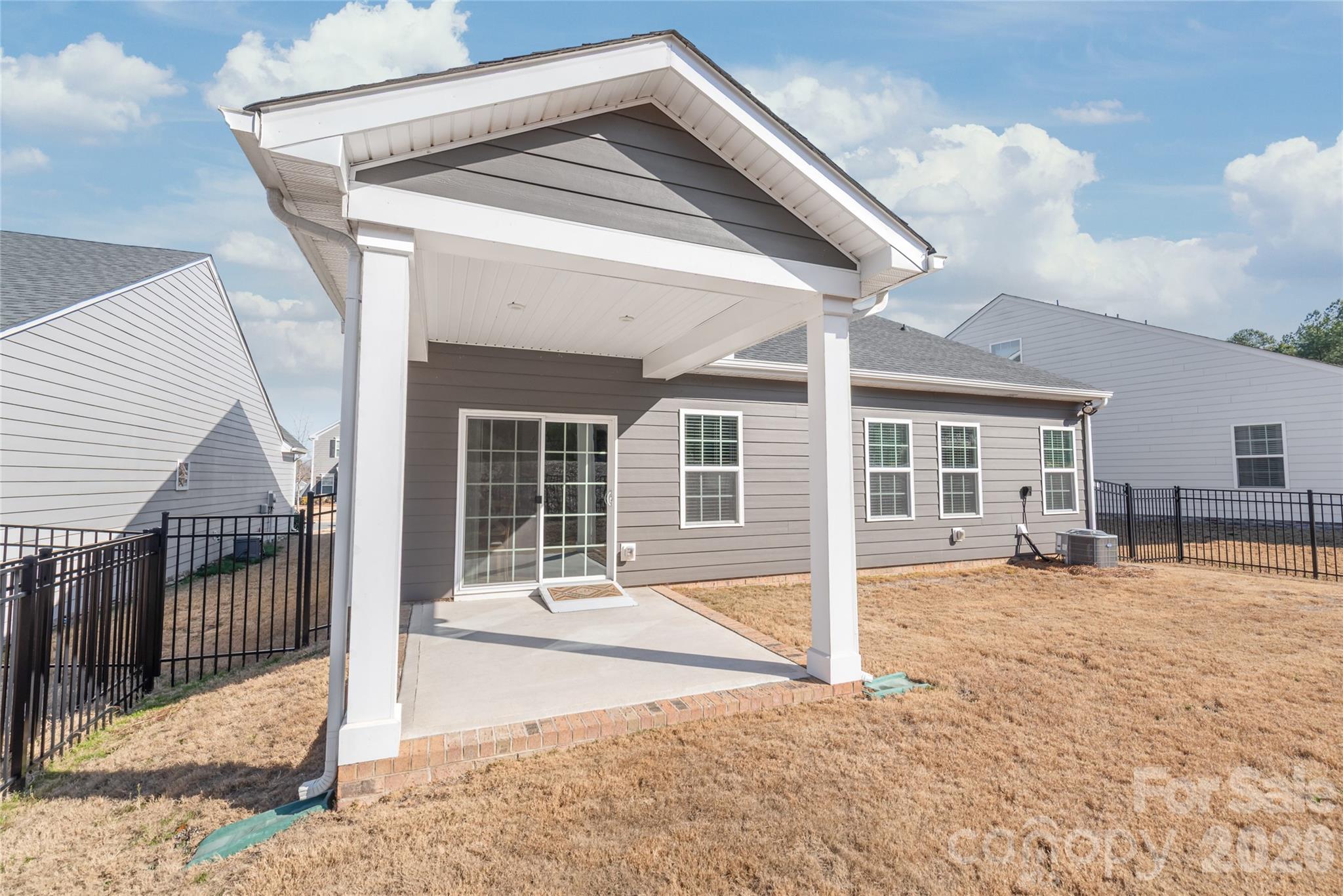 1960 Slippery Rock Lane Monroe, NC 28112 - Photo 27 of 32 a backyard of a house with basket ball court and outdoor seating