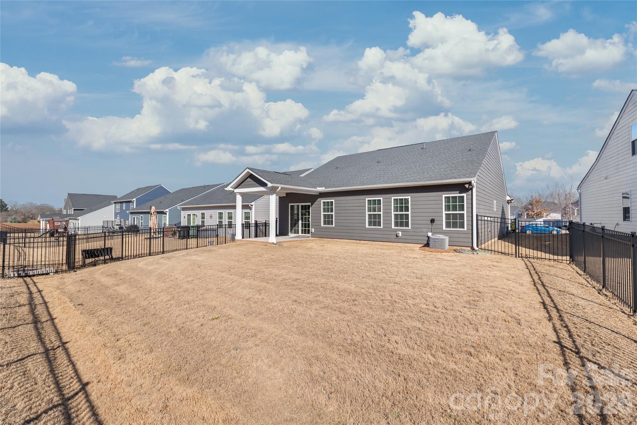 1960 Slippery Rock Lane Monroe, NC 28112 - Photo 29 of 32 a large house with a large space in front of it